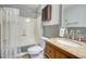 Bathroom with a shower and tub combination featuring modern fixtures and a granite countertop at 2926 Swarthmore Dr, Lawrenceville, GA 30044