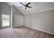 Spacious bedroom with high vaulted ceiling, a fan and neutral colors at 2926 Swarthmore Dr, Lawrenceville, GA 30044