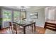Dining room with hardwood floors, natural light, and seating for six at 2926 Swarthmore Dr, Lawrenceville, GA 30044