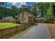 A detailed view of the home's exterior, highlighting its charming curb appeal, 2-car garage, and inviting porch at 2926 Swarthmore Dr, Lawrenceville, GA 30044