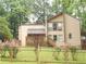 Charming home with a well-maintained lawn, black fence, and tasteful landscaping at 2926 Swarthmore Dr, Lawrenceville, GA 30044