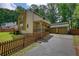A detailed view of the home's exterior, highlighting its charming curb appeal, 2-car garage, and inviting porch at 2926 Swarthmore Dr, Lawrenceville, GA 30044