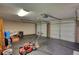 Spacious two car garage with black flooring and two garage doors provides ample storage space at 2926 Swarthmore Dr, Lawrenceville, GA 30044