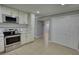 Open concept kitchen with stainless steel appliances, ample cabinet space, and tile floors at 2926 Swarthmore Dr, Lawrenceville, GA 30044