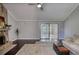 Cozy living room with a stone fireplace, dark hardwood floors, and neutral paint colors at 2926 Swarthmore Dr, Lawrenceville, GA 30044