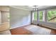 Spacious living room featuring hard wood floors and large windows to let in natural light at 2926 Swarthmore Dr, Lawrenceville, GA 30044