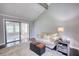 Open living room with vaulted ceiling, dark hardwood floors and glass patio doors at 2926 Swarthmore Dr, Lawrenceville, GA 30044