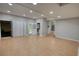 Bright, open living space with tile flooring, recessed lights, and doors to the backyard at 2926 Swarthmore Dr, Lawrenceville, GA 30044