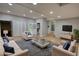 Staged living room showcasing neutral walls, recessed lighting, and contemporary furniture on a decorative rug at 2926 Swarthmore Dr, Lawrenceville, GA 30044