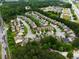 An aerial view of a neighborhood featuring well-maintained homes, lush trees, and convenient access to nearby highways at 3637 Sweet Ashley Ln, Loganville, GA 30052