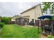 Spacious backyard features a screened porch and privacy fence, ideal for outdoor gatherings and relaxing at 3637 Sweet Ashley Ln, Loganville, GA 30052