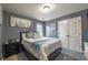 Bedroom with city scape art, blue walls, nice decor and a cozy feel at 3637 Sweet Ashley Ln, Loganville, GA 30052