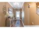 Inviting foyer featuring hardwood floors, elegant decor, and a view of the front door at 3637 Sweet Ashley Ln, Loganville, GA 30052