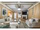 Spacious living room with a fireplace, coffered ceilings, and comfortable seating at 3637 Sweet Ashley Ln, Loganville, GA 30052