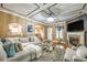 Elegant living room featuring a fireplace, stylish decor, and an open layout at 3637 Sweet Ashley Ln, Loganville, GA 30052
