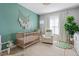 Stylish Bedroom with crib, rocker, and large window for natural light at 508 Vinings Forest Se Ct, Smyrna, GA 30080