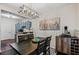 Dining room with modern light fixture and view of the adjacent kitchen at 508 Vinings Forest Se Ct, Smyrna, GA 30080
