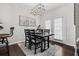 Dining room with modern light fixture and door to the patio at 508 Vinings Forest Se Ct, Smyrna, GA 30080