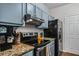 Close-up of kitchen featuring stainless steel appliances and stylish countertops at 508 Vinings Forest Se Ct, Smyrna, GA 30080