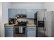 Updated kitchen features stainless steel appliances and granite countertops at 508 Vinings Forest Se Ct, Smyrna, GA 30080