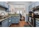 This kitchen features granite countertops and seamlessly connects to the dining area at 508 Vinings Forest Se Ct, Smyrna, GA 30080
