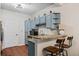 Kitchen with stylish countertops, a breakfast bar, and views of the entry door at 508 Vinings Forest Se Ct, Smyrna, GA 30080