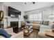 Comfortable living room with fireplace, sectional sofa, and hardwood floors at 508 Vinings Forest Se Ct, Smyrna, GA 30080