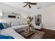 Cozy living room with a sectional sofa, accent chair, and view into an entry door at 508 Vinings Forest Se Ct, Smyrna, GA 30080