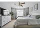 Bright primary bedroom with a ceiling fan and natural light at 508 Vinings Forest Se Ct, Smyrna, GA 30080