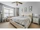 Bright primary bedroom offers a seating area and natural light at 508 Vinings Forest Se Ct, Smyrna, GA 30080