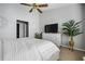 Inviting primary bedroom with a TV and natural light at 508 Vinings Forest Se Ct, Smyrna, GA 30080