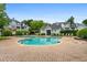 Community pool area with lounge chairs and surrounding buildings at 508 Vinings Forest Se Ct, Smyrna, GA 30080