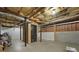Unfinished basement with storage room and exposed ceiling at 6420 Marbut Rd, Lithonia, GA 30058