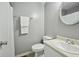 Clean bathroom featuring a toilet, vanity, and a shower curtain rod at 6420 Marbut Rd, Lithonia, GA 30058