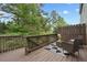 Inviting back deck with outdoor seating and views of lush greenery at 6420 Marbut Rd, Lithonia, GA 30058