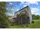Exterior view of a home with a deck, stairs, and backyard at 6420 Marbut Rd, Lithonia, GA 30058