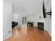 Living room featuring hardwood floors, a fireplace, a sliding door, and modern furnishings at 6420 Marbut Rd, Lithonia, GA 30058
