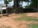 Spacious backyard featuring two storage sheds and a brick fire pit, offering ample outdoor space at 70 Paladin Dr, Covington, GA 30016