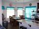 Cozy dining room area with natural lighting and view of kitchen at 70 Paladin Dr, Covington, GA 30016