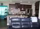 Well-equipped kitchen features dark cabinets, granite countertops, and stainless steel appliances at 70 Paladin Dr, Covington, GA 30016