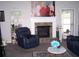 Comfortable living room showcases a brick fireplace and a cozy seating arrangement at 70 Paladin Dr, Covington, GA 30016