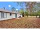 Large fenced-in backyard provides privacy and features a patio, perfect for outdoor entertaining at 1056 Park West Ct, Stone Mountain, GA 30088