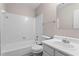 Cozy full bathroom with tiled shower, a toilet, and a sink with storage underneath at 1056 Park West Ct, Stone Mountain, GA 30088