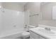 Full bathroom with tiled shower, toilet, and ample lighting over the sink and vanity at 1056 Park West Ct, Stone Mountain, GA 30088