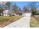 Lovely home with a long driveway and a well-manicured lawn at 1056 Park West Ct, Stone Mountain, GA 30088