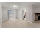 Living room with tile floors, a stone fireplace, and sliding door access at 1056 Park West Ct, Stone Mountain, GA 30088