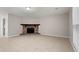Spacious living room with tile floors and a stone fireplace with black inset at 1056 Park West Ct, Stone Mountain, GA 30088