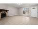 Living room featuring tile flooring, a stone fireplace, and a sunny front door at 1056 Park West Ct, Stone Mountain, GA 30088