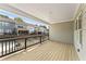 Spacious back porch with wood flooring overlooking the property at 1991 Deco Dr, Kennesaw, GA 30144