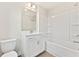 Bathroom features white cabinets, tile floors, and shower and tub combo at 1991 Deco Dr, Kennesaw, GA 30144